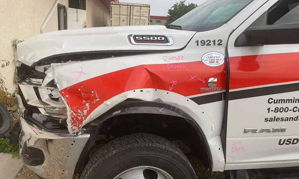 Damaged front fender and bumper on service truck Damaged front fender and bumper on service truck