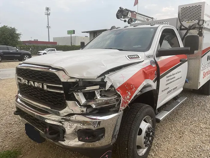 Damaged ram service truck before