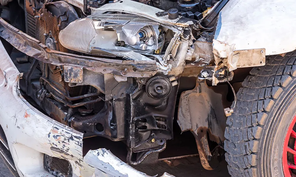 Severe front-end crash damage requiring auto body repair Severe front-end crash damage requiring auto body repair
