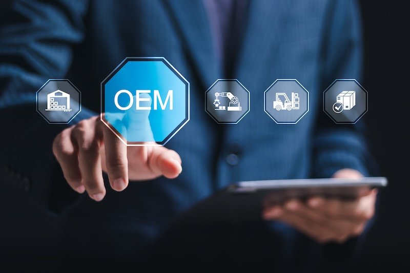 OEM or Original Equipment Manufacturer concept. Businessman touching virtual screen of OEM icon for strategies for planning product and brand production. Support to reduce cost and production time.